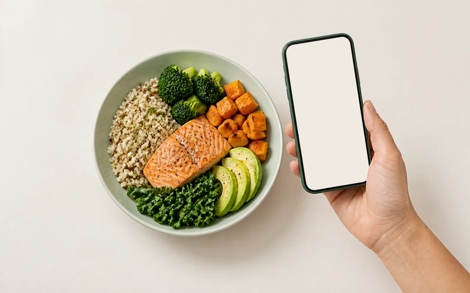 A phone positioned above a single balanced meal